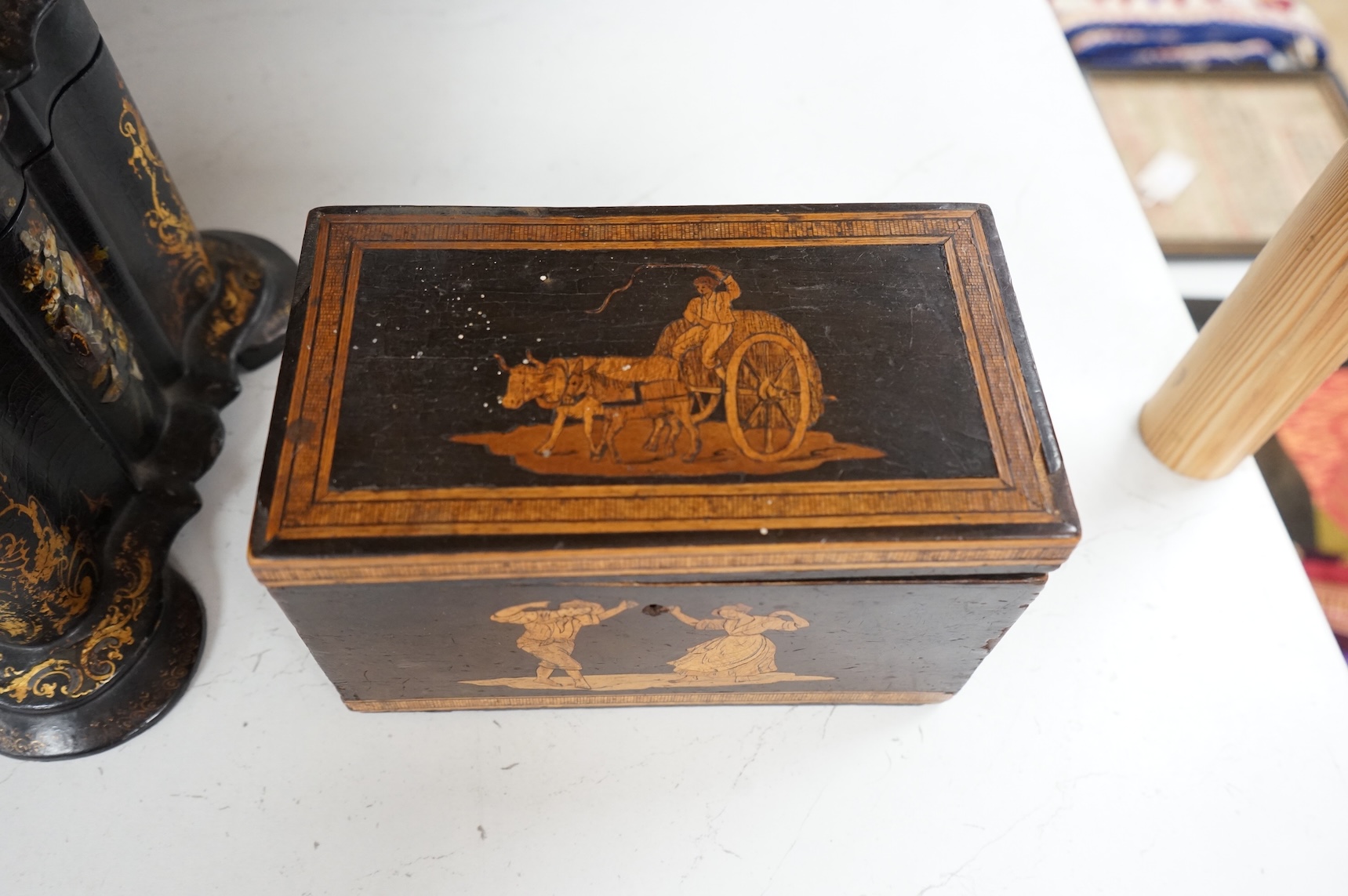 A large Victorian Papier maché and mother-of-pearl tea caddy, 32cm wide, and a Sorrento ware marquetry tea caddy, 19.5cm wide.